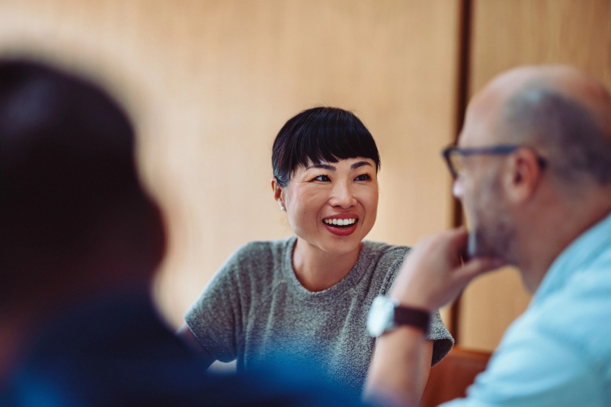 Colleagues collaborating in a meeting to strengthen workplace culture